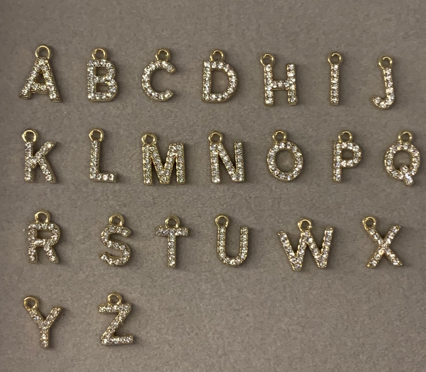 Mini gold initial